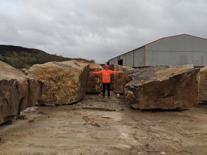 Image of our work experience student Thomas, from Bolton Sixth Form College, down at our stone yard.